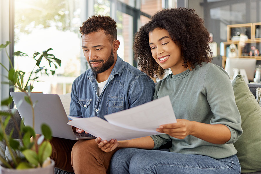 A Couple Reviewing Their Loan APR - Check `n Go