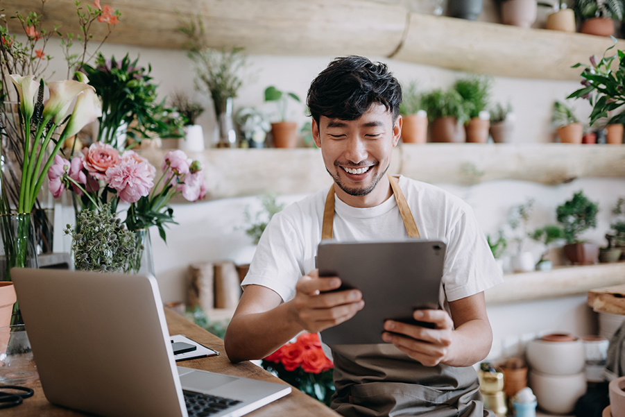 Man on his computer and tablet.