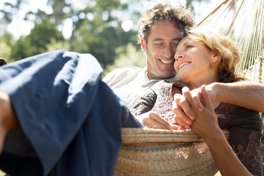 Couple Laying in Hammock - Happy About an Installment Loan
