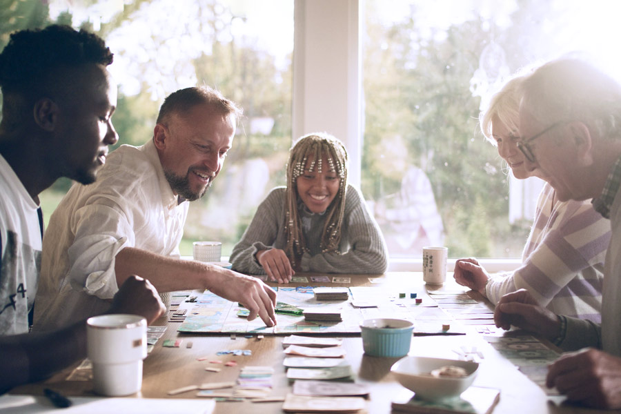 Family Playing Board Games at the Table