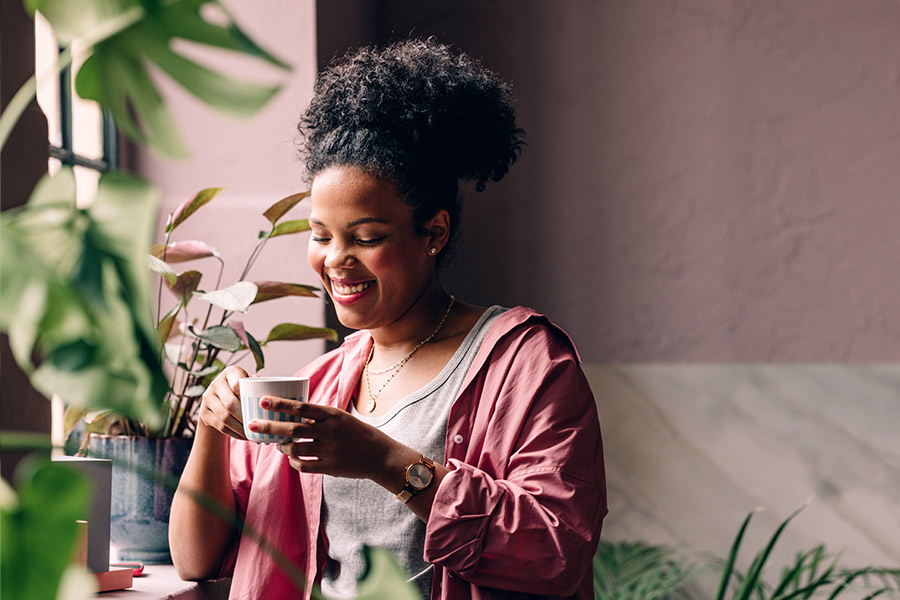 Happy Woman Drinking Coffee - Check `n Go