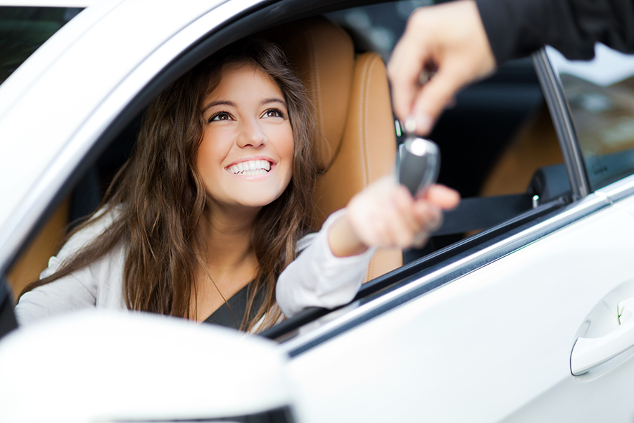 Woman leasing a new car.