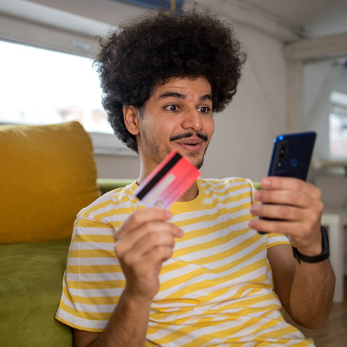 Man Shocked While Looking at Credit Card Debt on His Phone