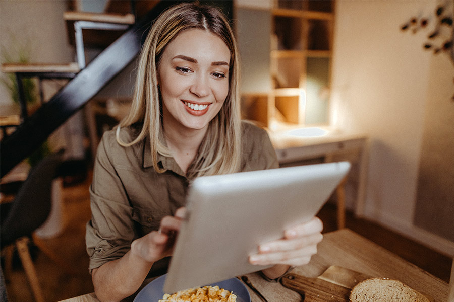 Woman Checking Credit Score on Tablet - Check `n Go