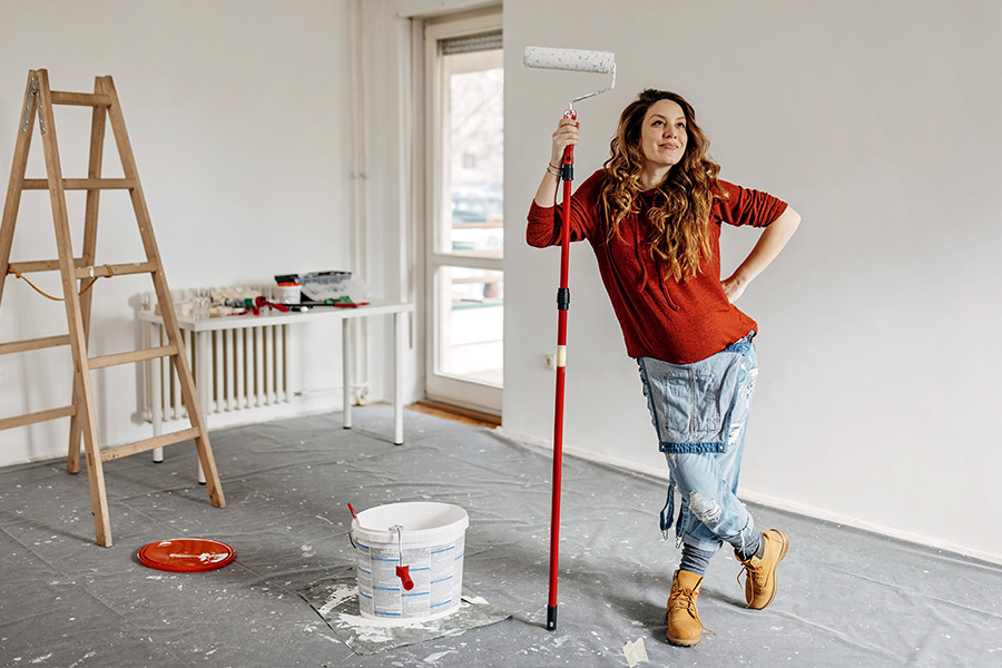Woman Painting Home During Home Renovation