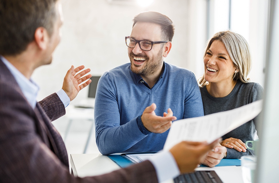 Man and woman talking to financial advisor